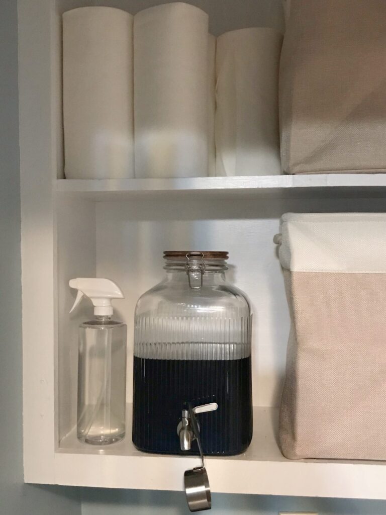 decant laundry detergent into decorative glass bottle