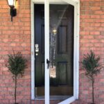 myrtle tree flanking front door for spring front porch decor