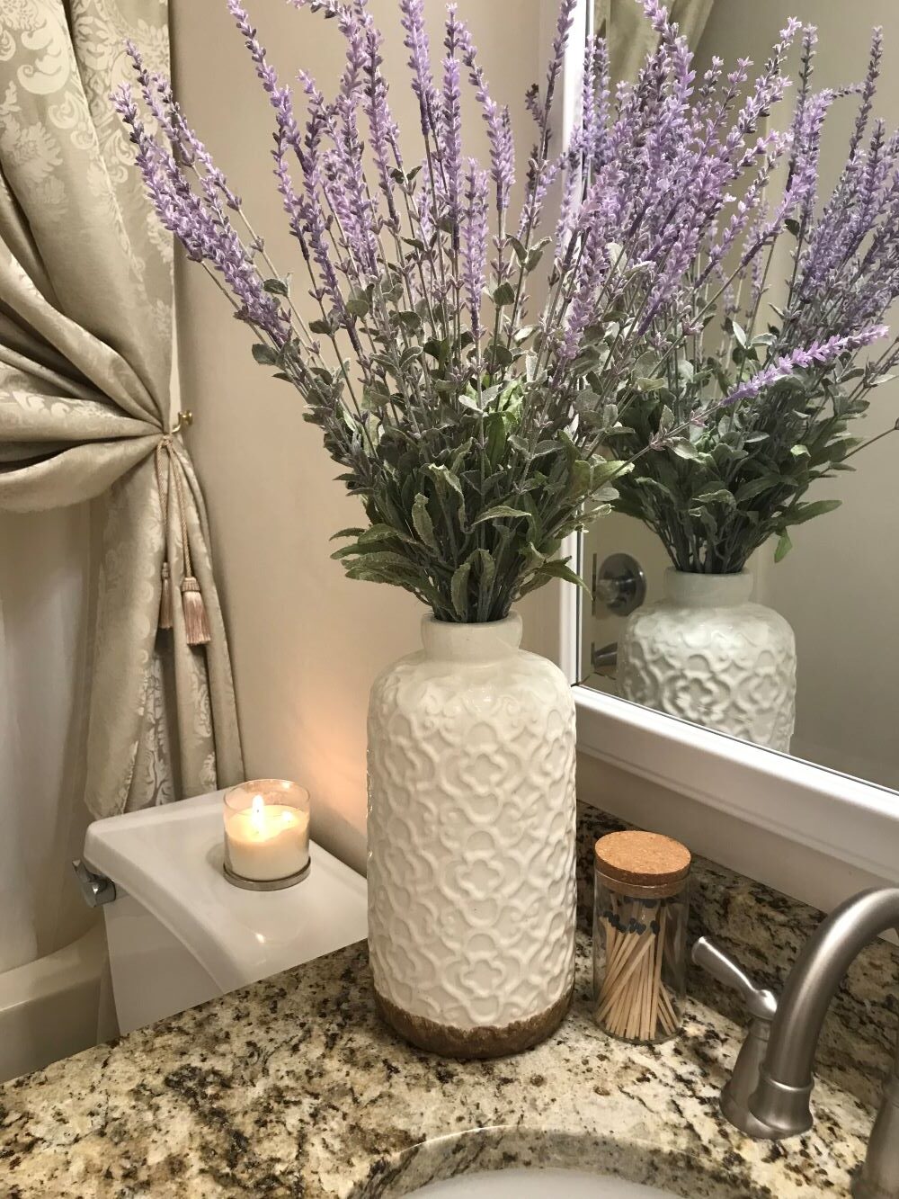 lavender bouquet in white vase on countertop for spring decor
