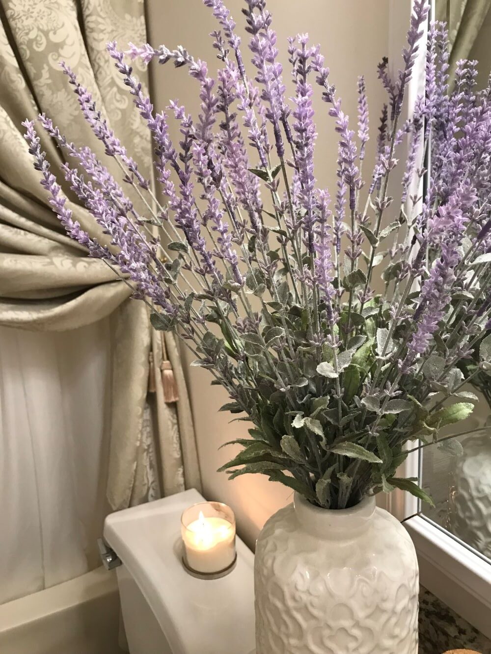 lavender bouquet in white vase on countertop for spring decor