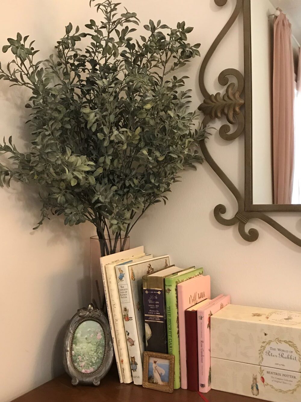 realistic faux greenery in pink glass vase on dresser for interior decorating for spring