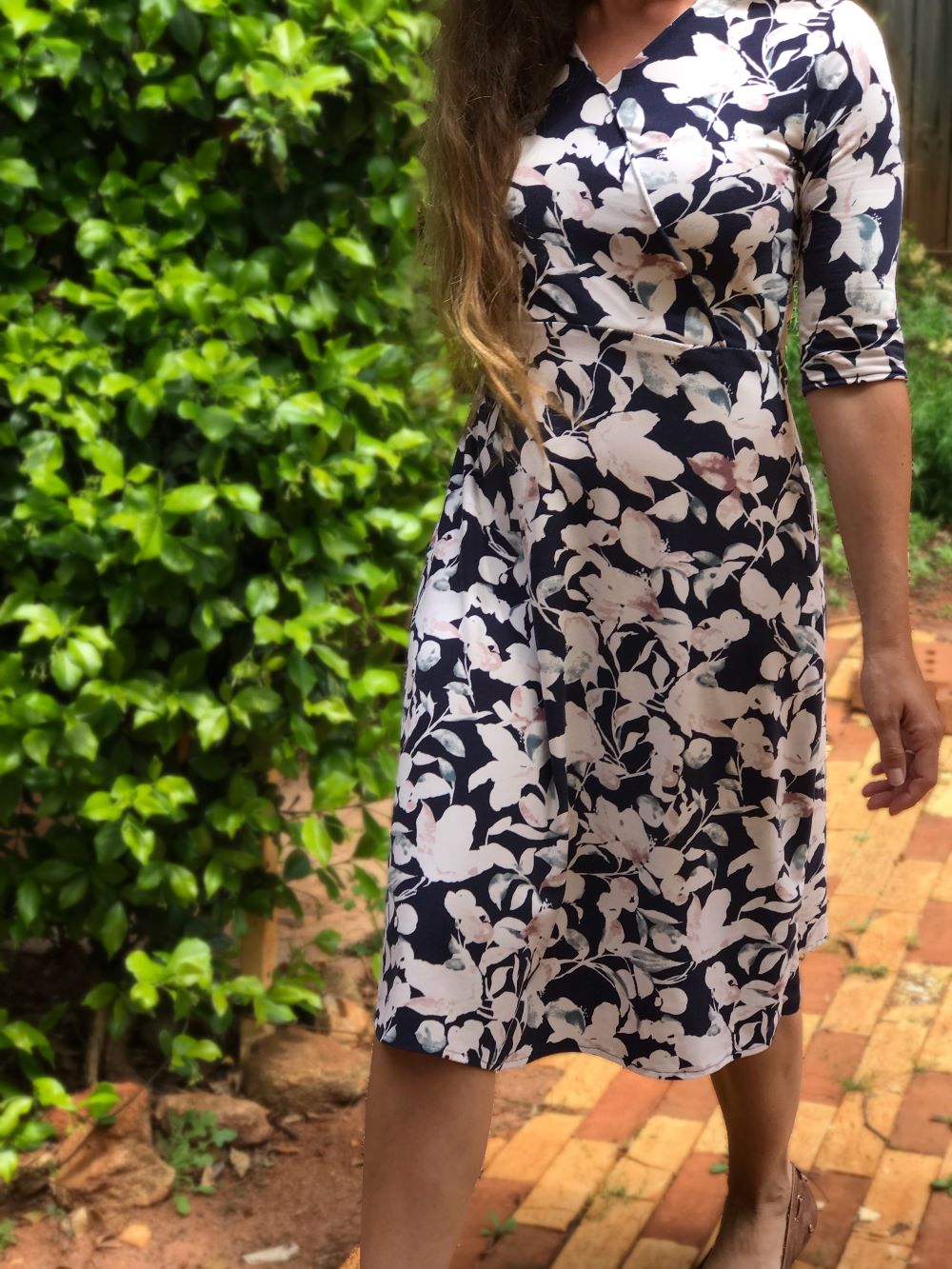 bringing feminine fashion back with midi dresses and skirts, floral fabric, and classic pieces