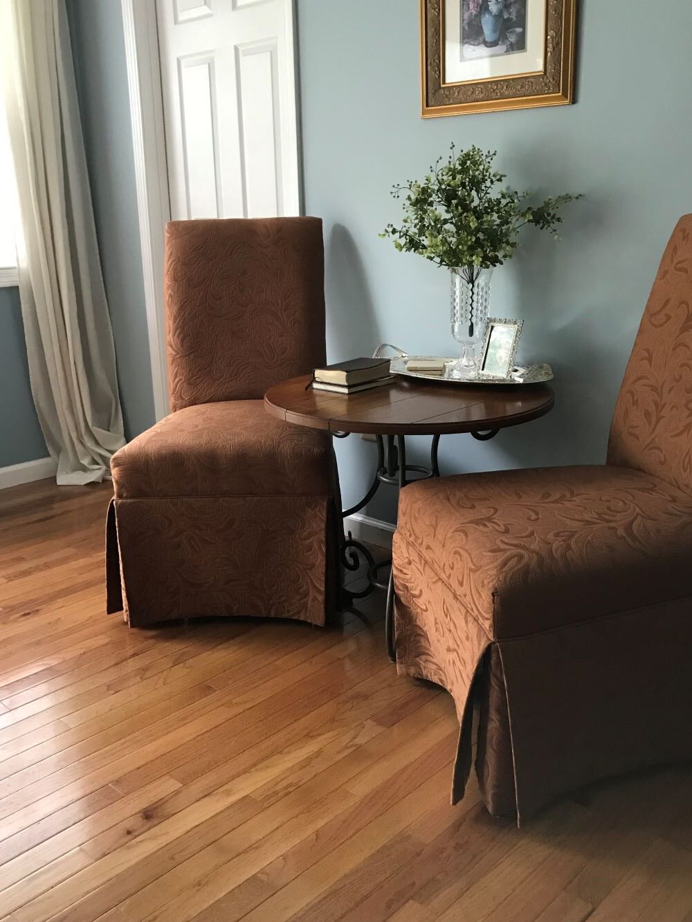 two chairs at a small table for coffee in sitting area for master bedroom