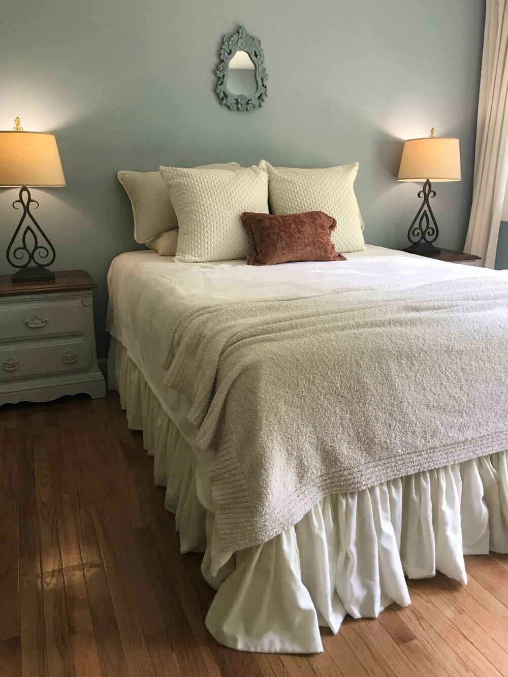 master bedroom bed with nightstands and lamps