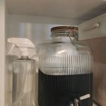 laundry room shelving with detergent in glass jar