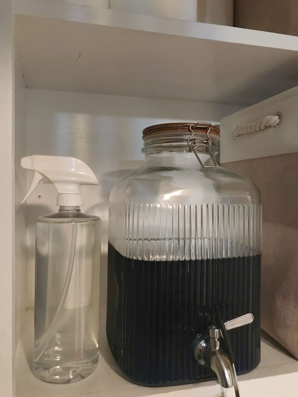 laundry room shelving with detergent in glass jar