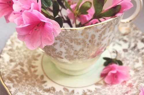 teacup with pink flowers in it