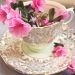 teacup with pink flowers in it