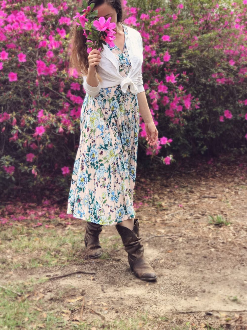 Christian homemaker picking flowers wearing long dress